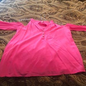 Bright pink Lilly pulitzer top opens at shoulder.